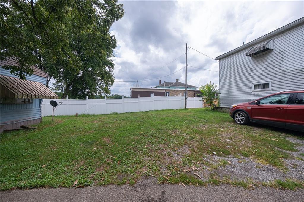221-227 Spring Street Harwick, PA 15049 - Photo 45 of 49 a view of a house with a back yard