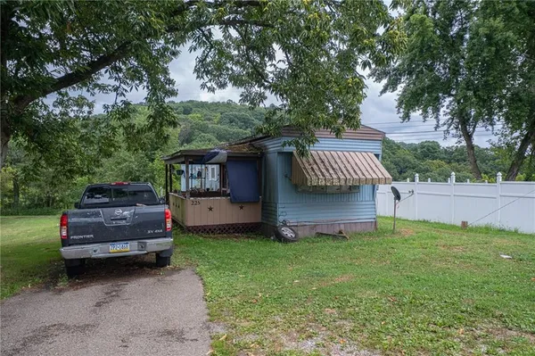 a view of a house with a back yard