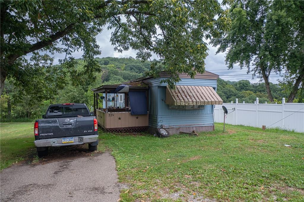 221-227 Spring Street Harwick, PA 15049 - Photo 5 of 49 a view of a house with a back yard