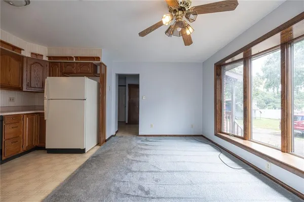 a view of a storage & utility room with closet window