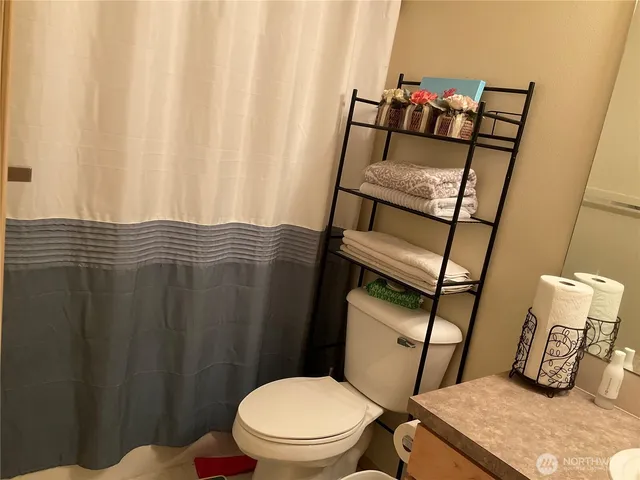 a bathroom with a sink and toilet