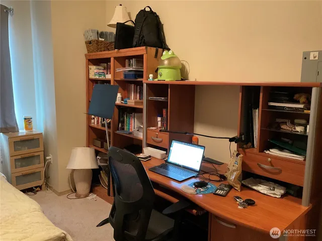 a view of workspace with cabinets