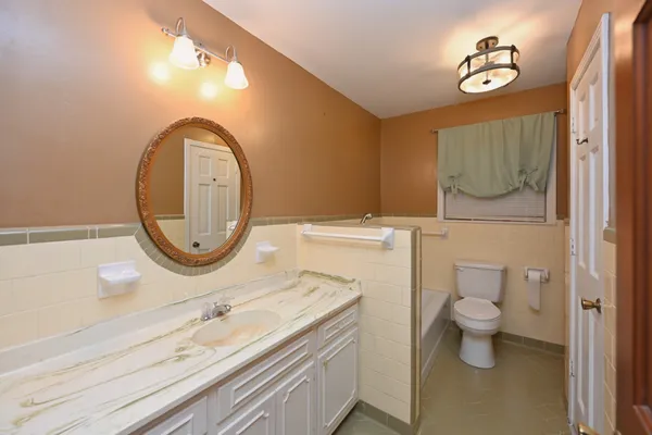 a view of a bathroom from a hallway