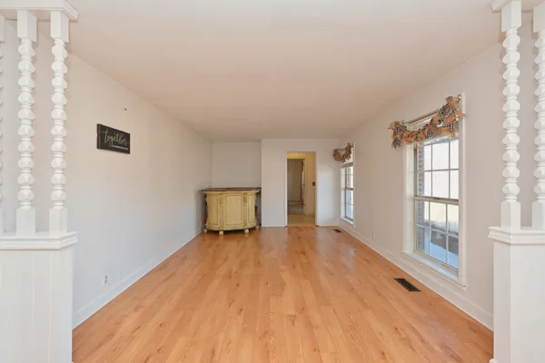 a bathroom with a granite countertop toilet sink and mirror