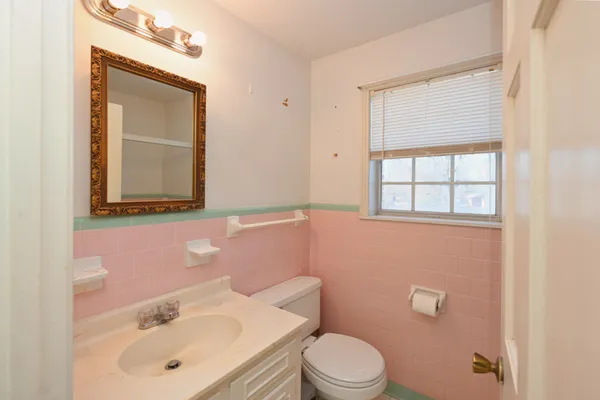 a kitchen with stainless steel appliances a refrigerator oven a sink dishwasher and a stove with wooden floor