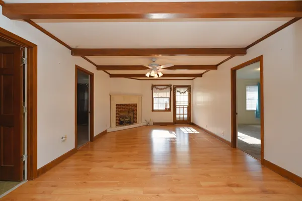 a view of an empty room with a window