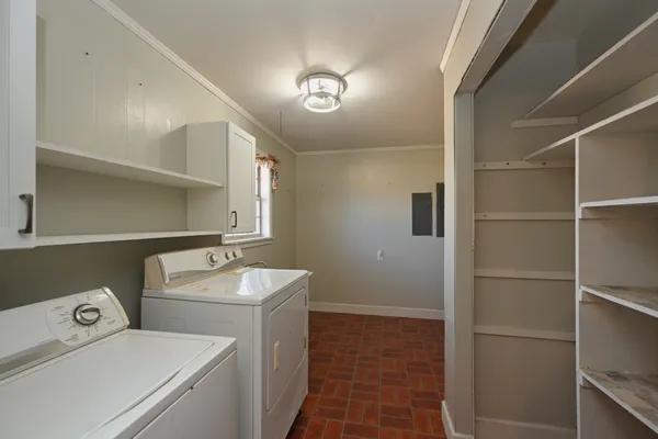 a room with a bed and wooden floor