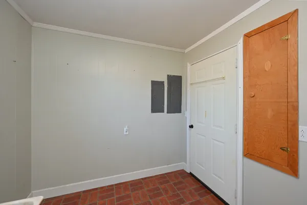 a bedroom with a bed and a mirror