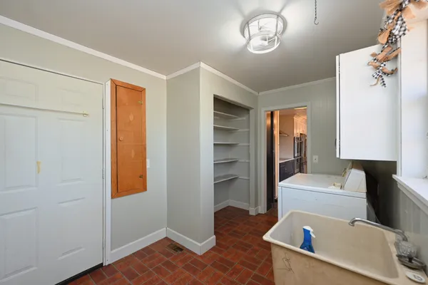 a living room with a bed furniture and a window