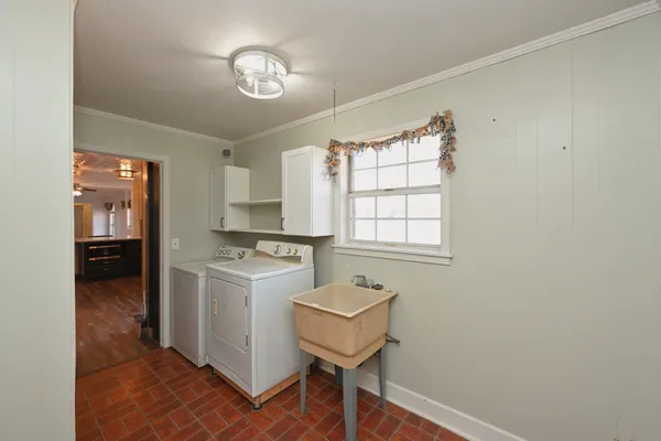 a bedroom with a bed closet and mirror