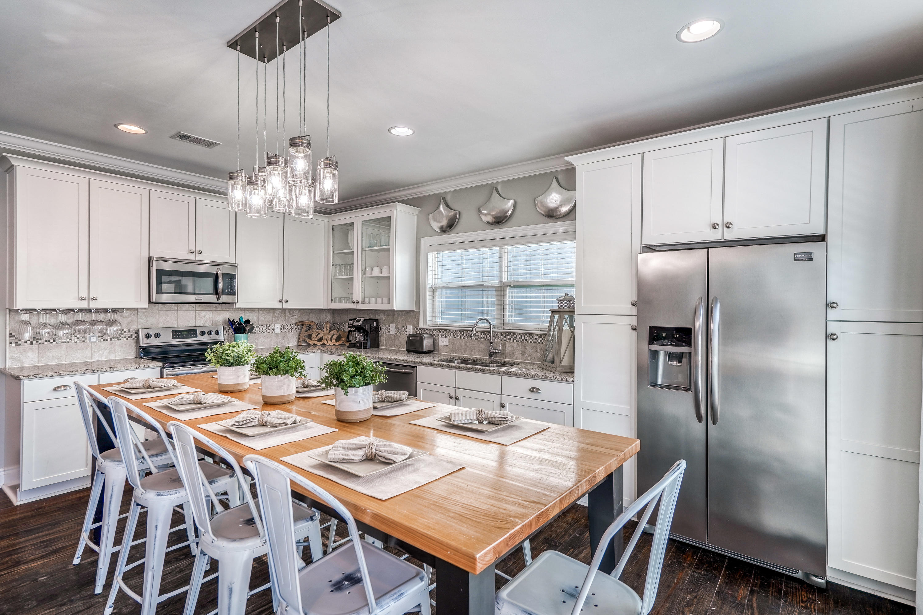 29 Payne Street Miramar Beach, FL 32550 - Photo 12 of 49 a kitchen with a dining table and chairs