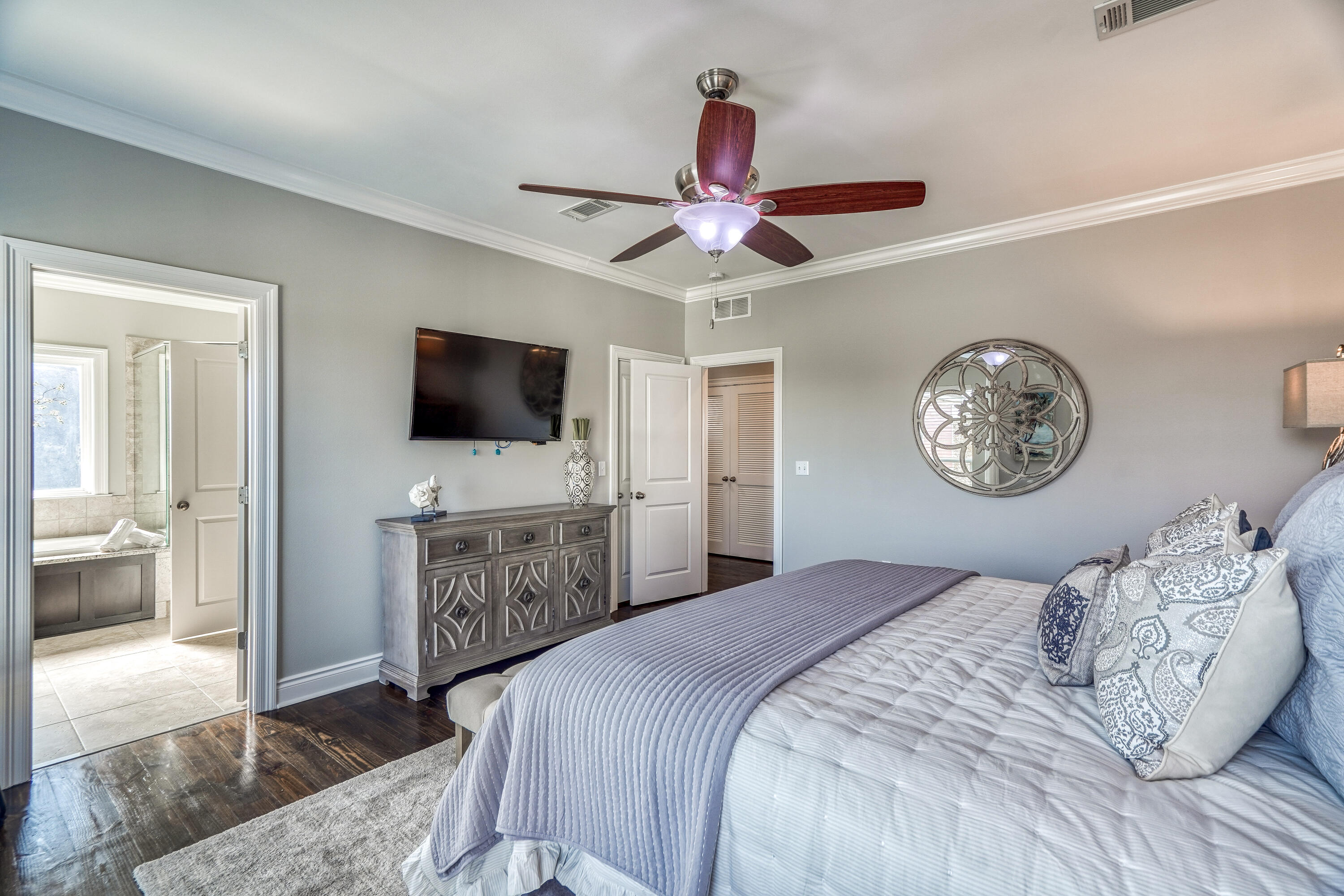 29 Payne Street Miramar Beach, FL 32550 - Photo 19 of 49 a bedroom with a large bed and a flat tv screen on dresser