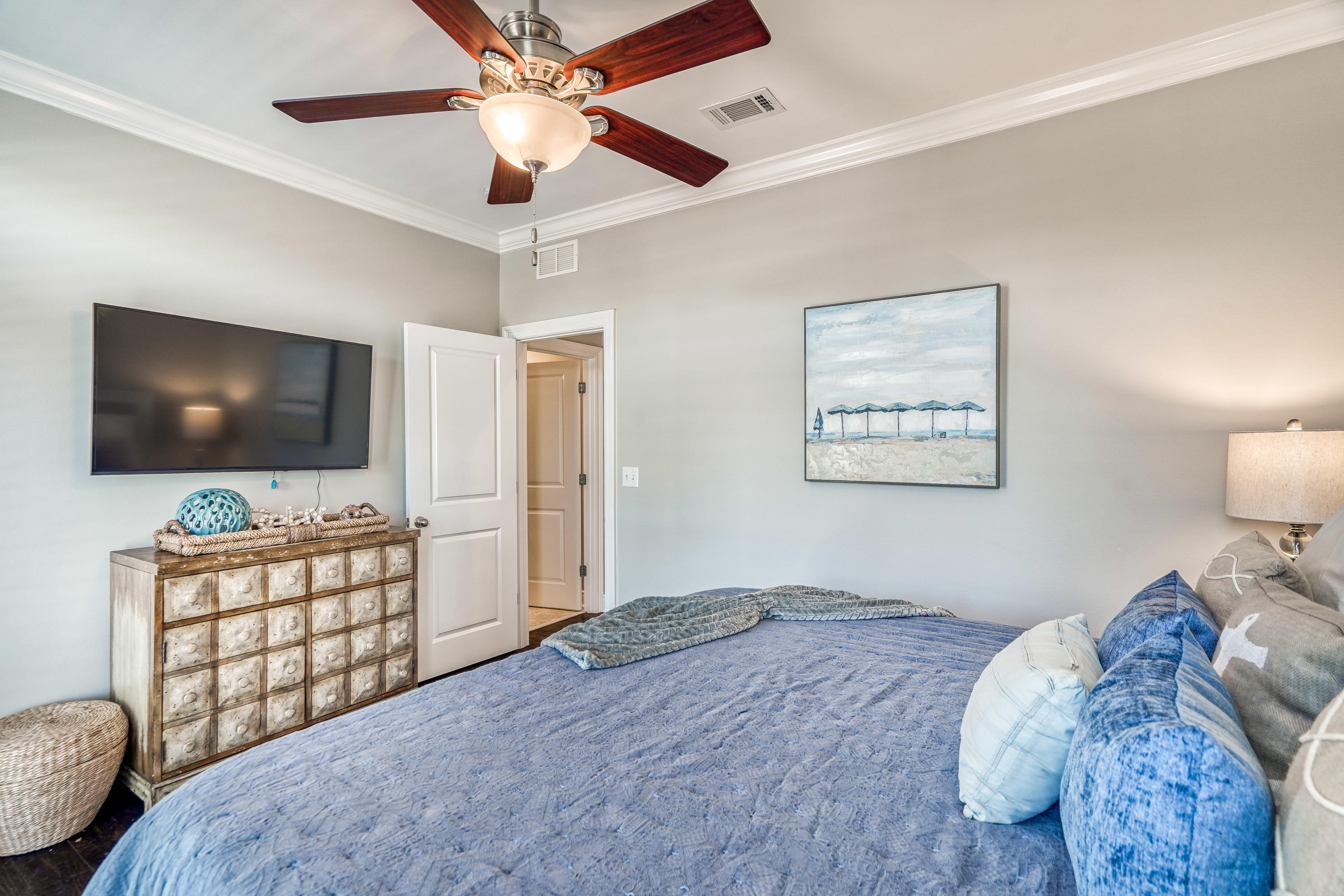 29 Payne Street Miramar Beach, FL 32550 - Photo 29 of 49 a bedroom with furniture and a flat screen tv