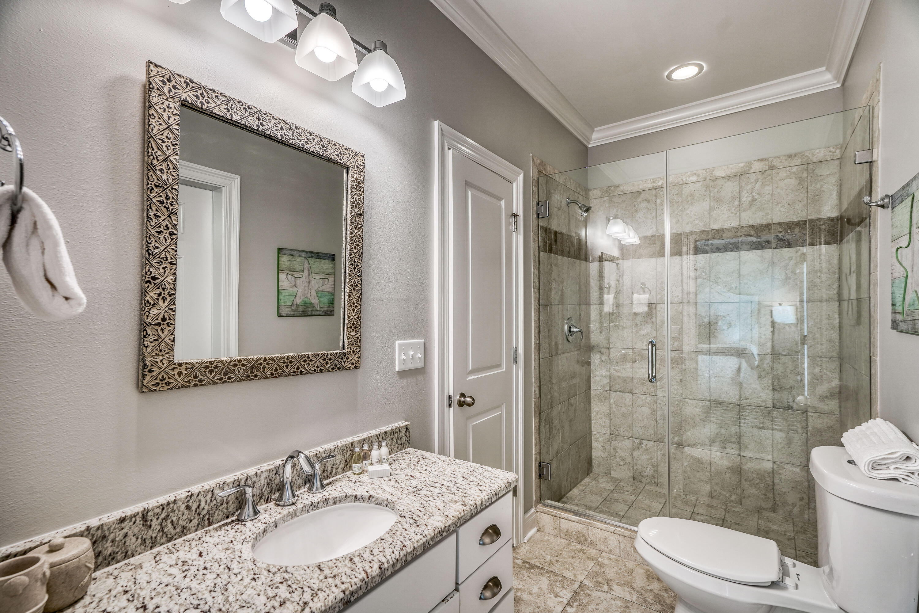 29 Payne Street Miramar Beach, FL 32550 - Photo 33 of 49 a bathroom with a sink granite toilet and shower