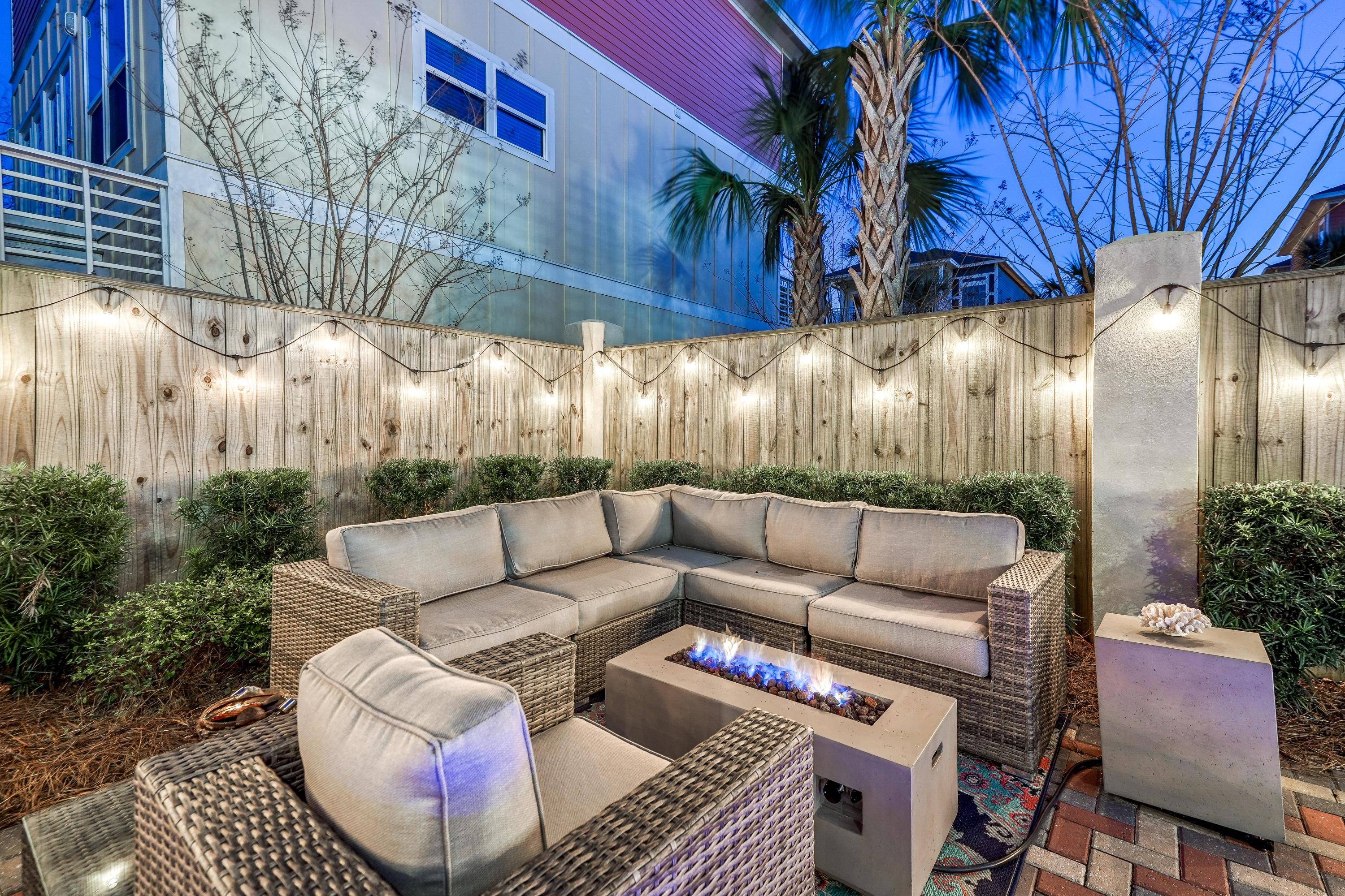 29 Payne Street Miramar Beach, FL 32550 - Photo 44 of 49 a view of a backyard with couches and a table and chairs