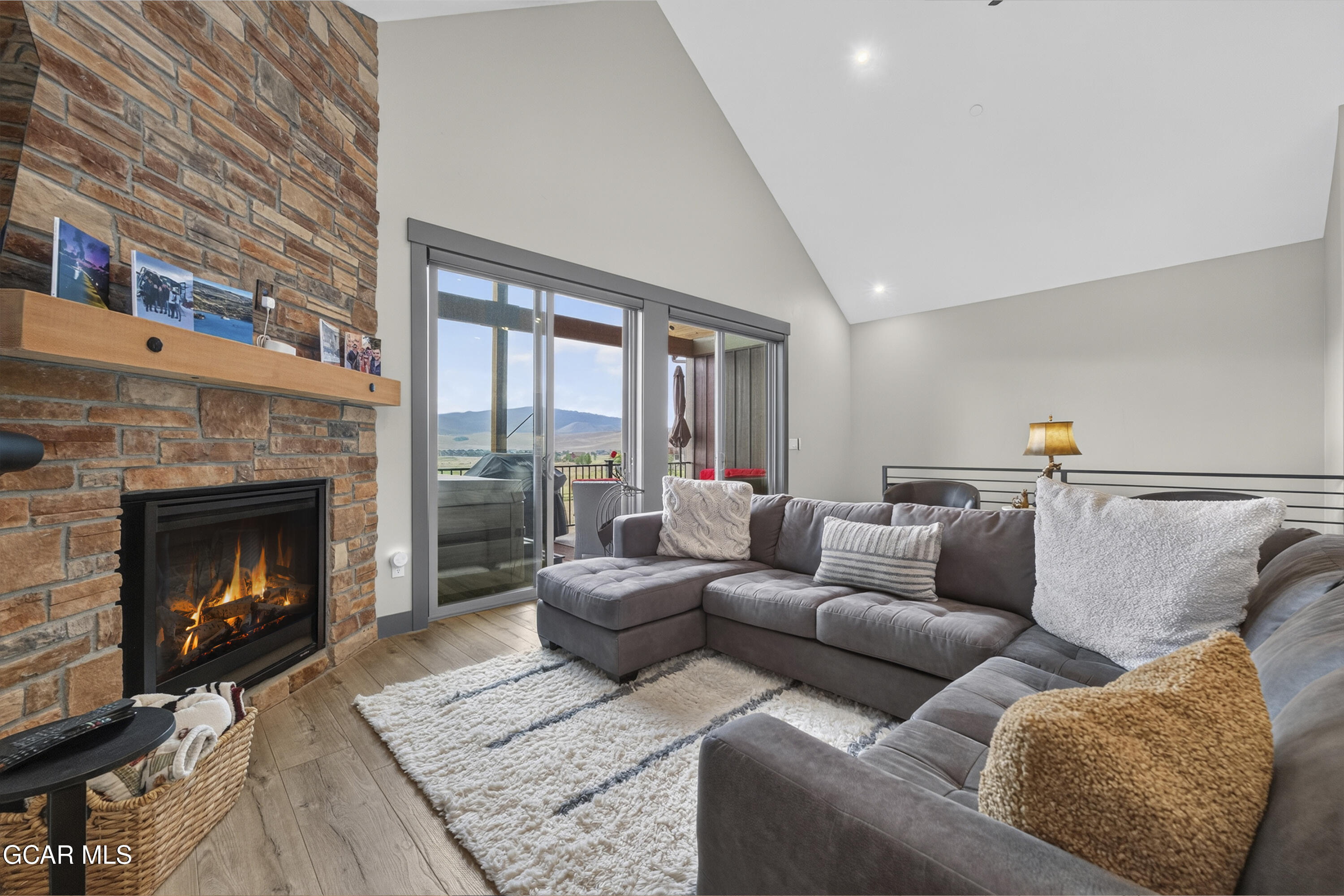 154 Eagle Ridge Drive Granby, CO 80446 - Photo 1 of 59 a living room with furniture and a fireplace