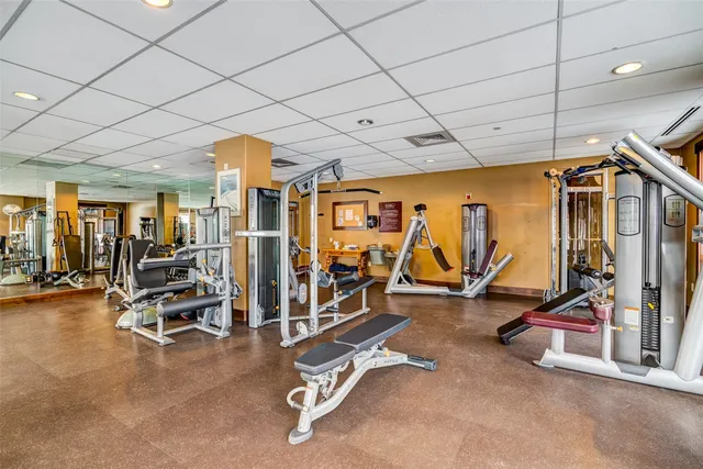 a bedroom with furniture and a flat screen tv