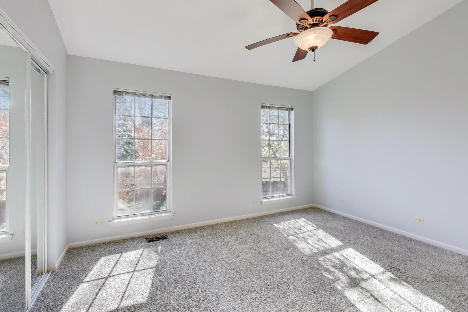 1303 Cranbrook Court Schaumburg, IL 60193 - Photo 11 of 29 a view of an empty room with a window