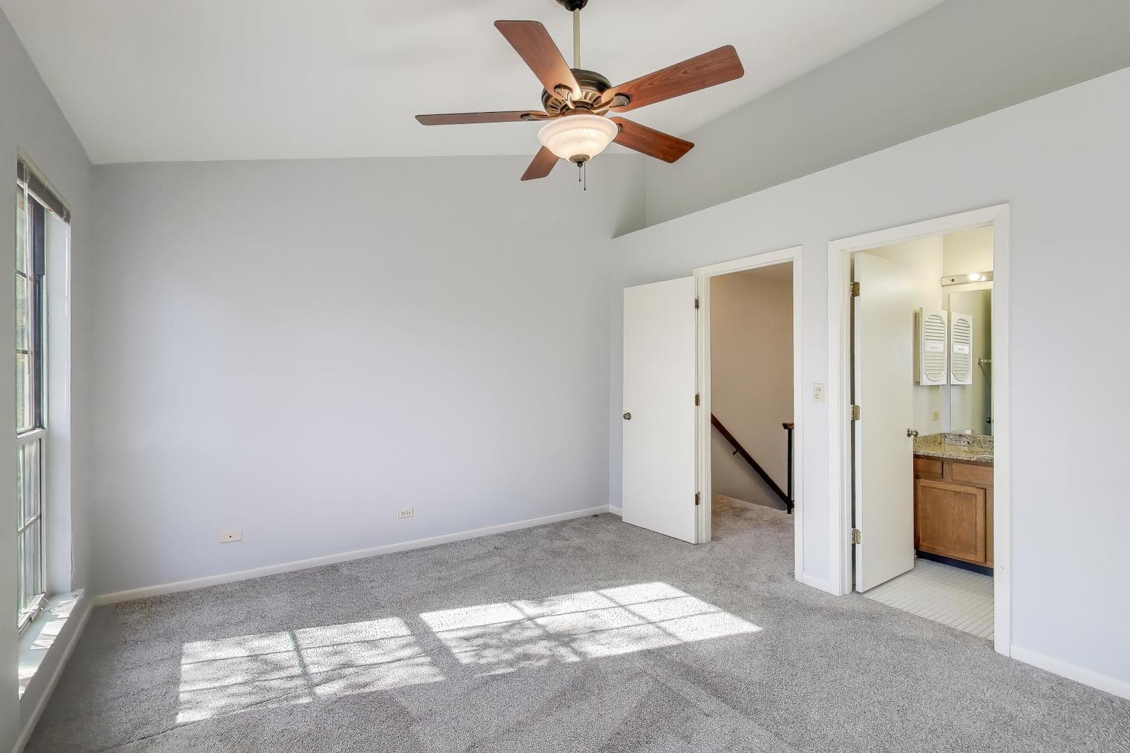 1303 Cranbrook Court Schaumburg, IL 60193 - Photo 12 of 29 a view of an empty room and window