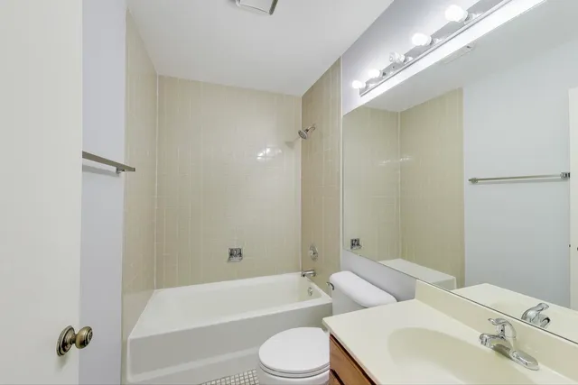 a bathroom with a toilet sink and bathtub