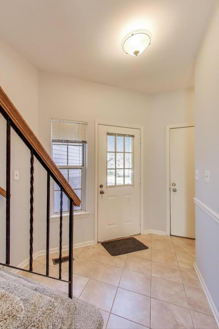 1303 Cranbrook Court Schaumburg, IL 60193 - Photo 26 of 29 a view of an entryway with staircase