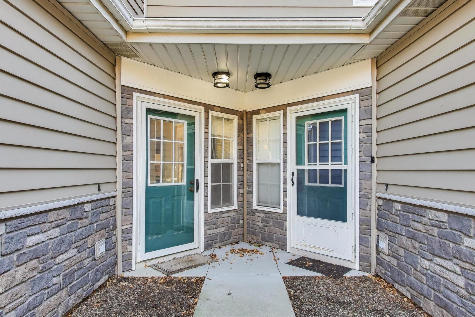 1303 Cranbrook Court Schaumburg, IL 60193 - Photo 27 of 29 a view of a entryway door front of house