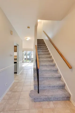 a view of entryway and hall with a rug