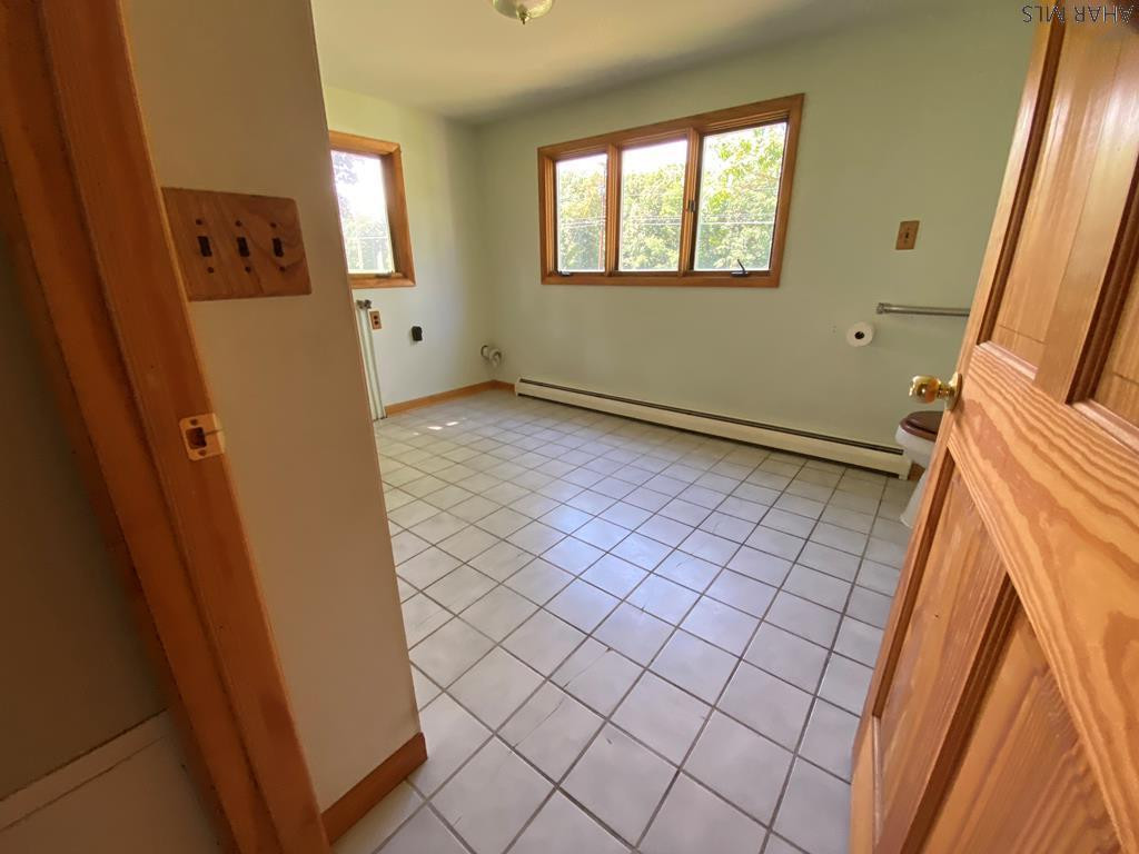 1648 Allegheny Road Manns Choice, PA 15550 - Photo 24 of 53 a view of an empty room with window and wooden floor