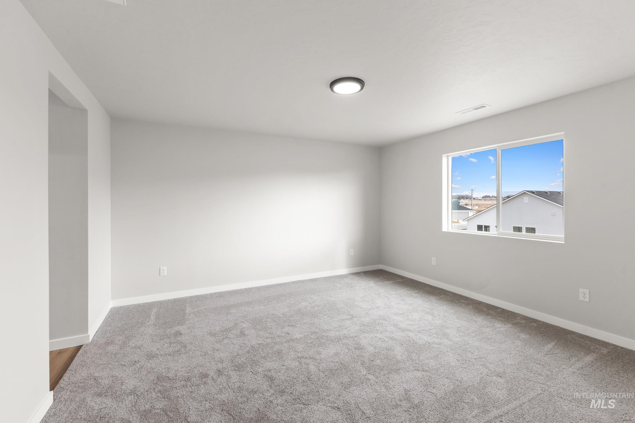 461 Waverly Avenue Middleton, ID 83644 - Photo 17 of 22 Unfurnished room with light colored carpet and baseboards