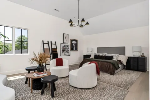 a living room with furniture a ceiling fan and a window
