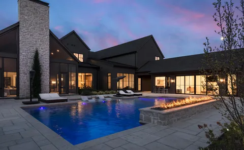 a view of a swimming pool with an outdoor seating
