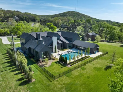 an aerial view of a house with a garden