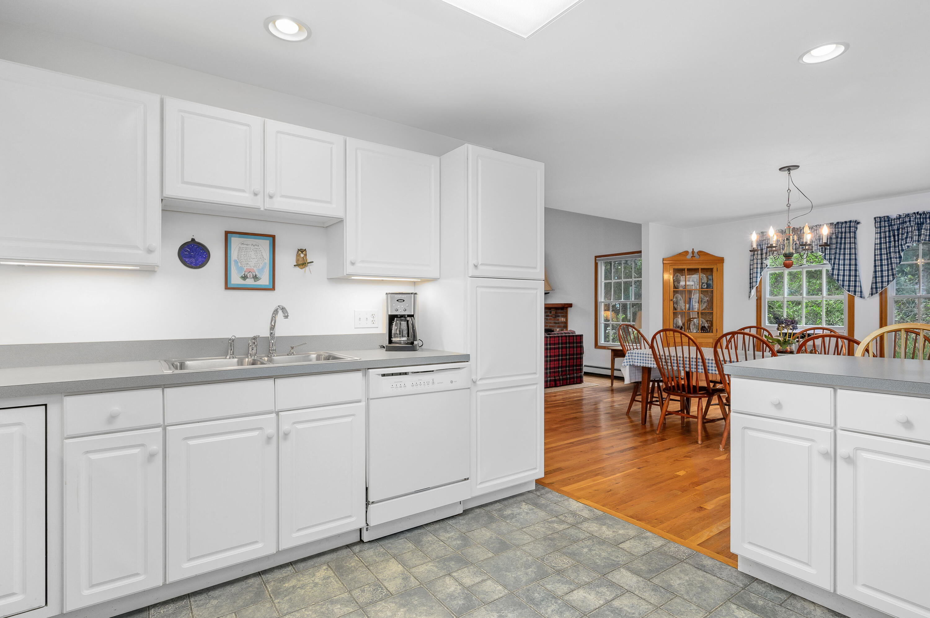 86 Old Wharf Road Wellfleet, MA 02667 - Photo 11 of 37 a kitchen with white cabinets and sink