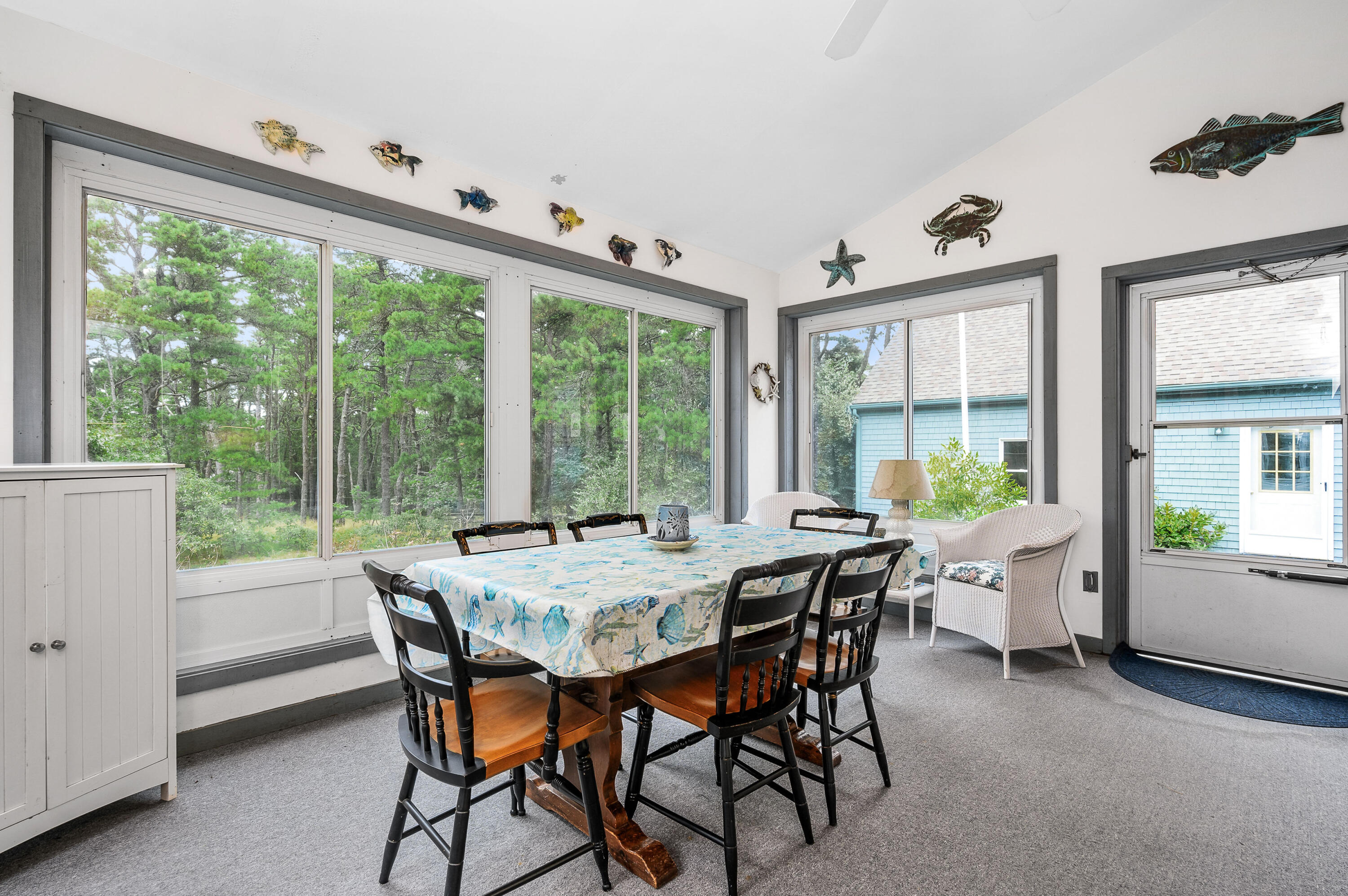 86 Old Wharf Road Wellfleet, MA 02667 - Photo 13 of 37 a view of a dining room with furniture window and outside view
