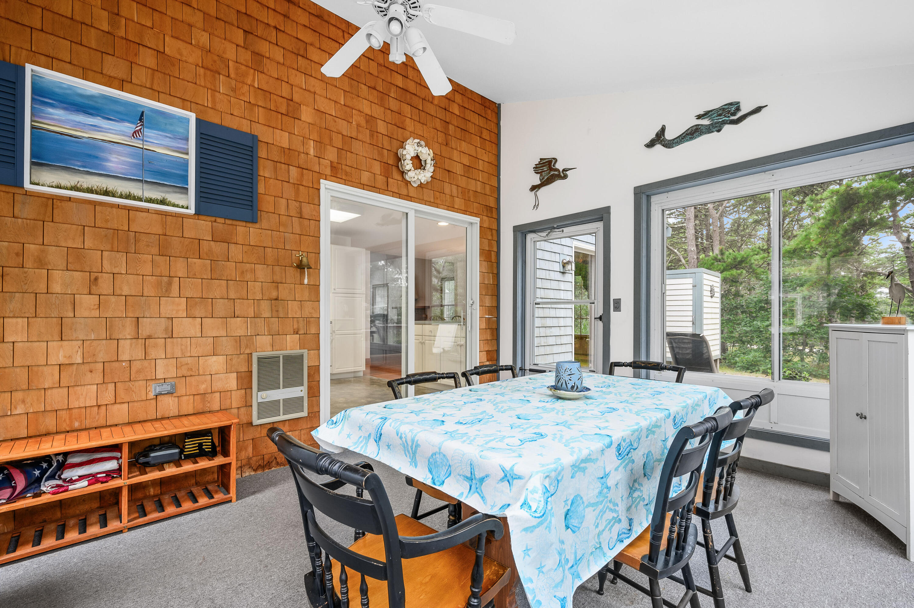 86 Old Wharf Road Wellfleet, MA 02667 - Photo 14 of 37 a dining room with a table and chairs