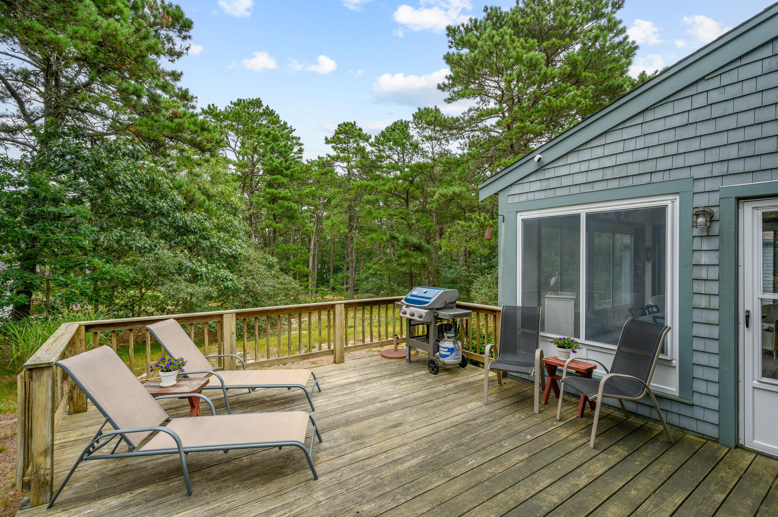 86 Old Wharf Road Wellfleet, MA 02667 - Photo 16 of 37 a view of a deck with wooden floor and outdoor seating