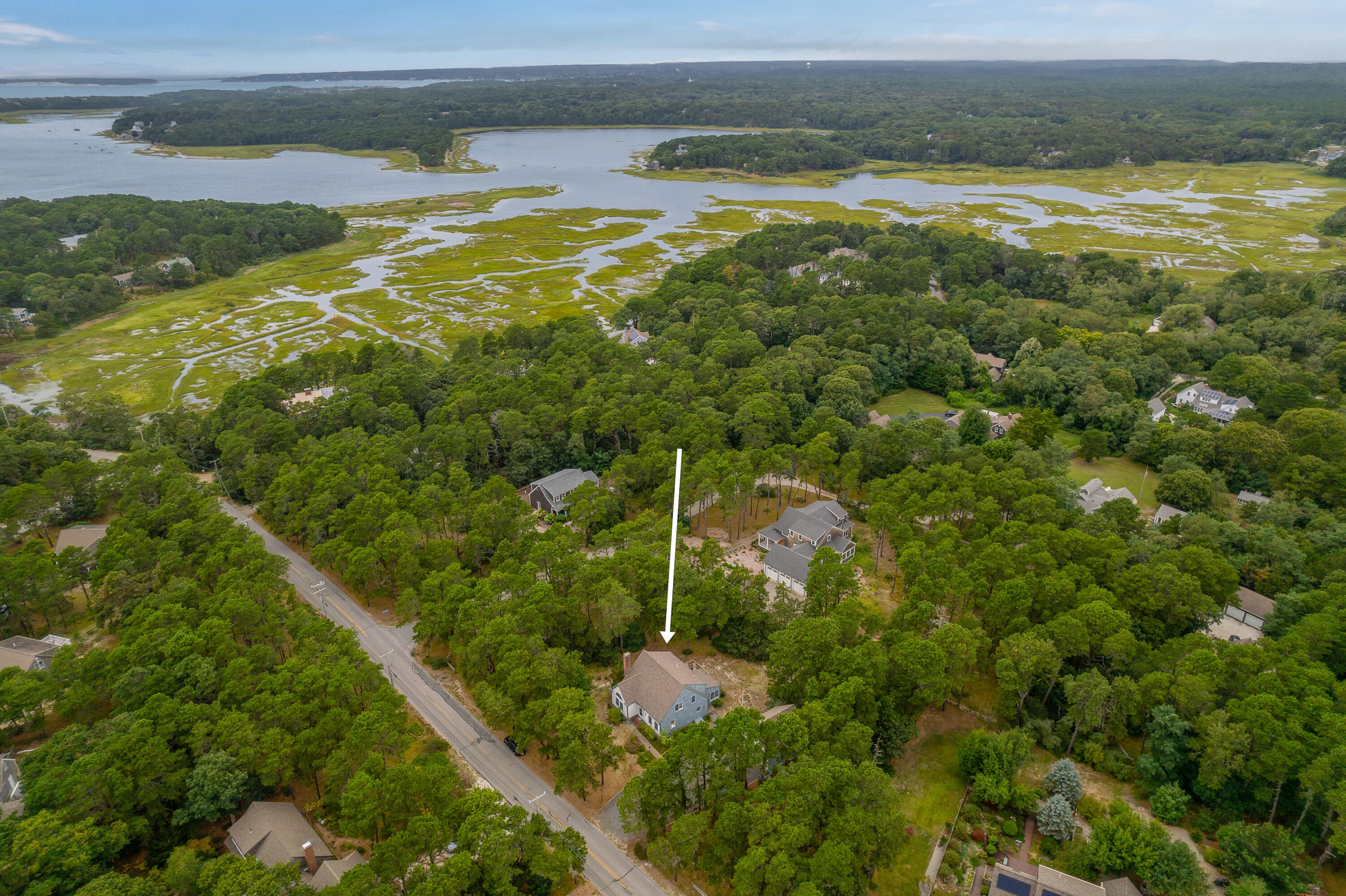 86 Old Wharf Road Wellfleet, MA 02667 - Photo 2 of 37 a backyard of a house with a yard and outdoor seating