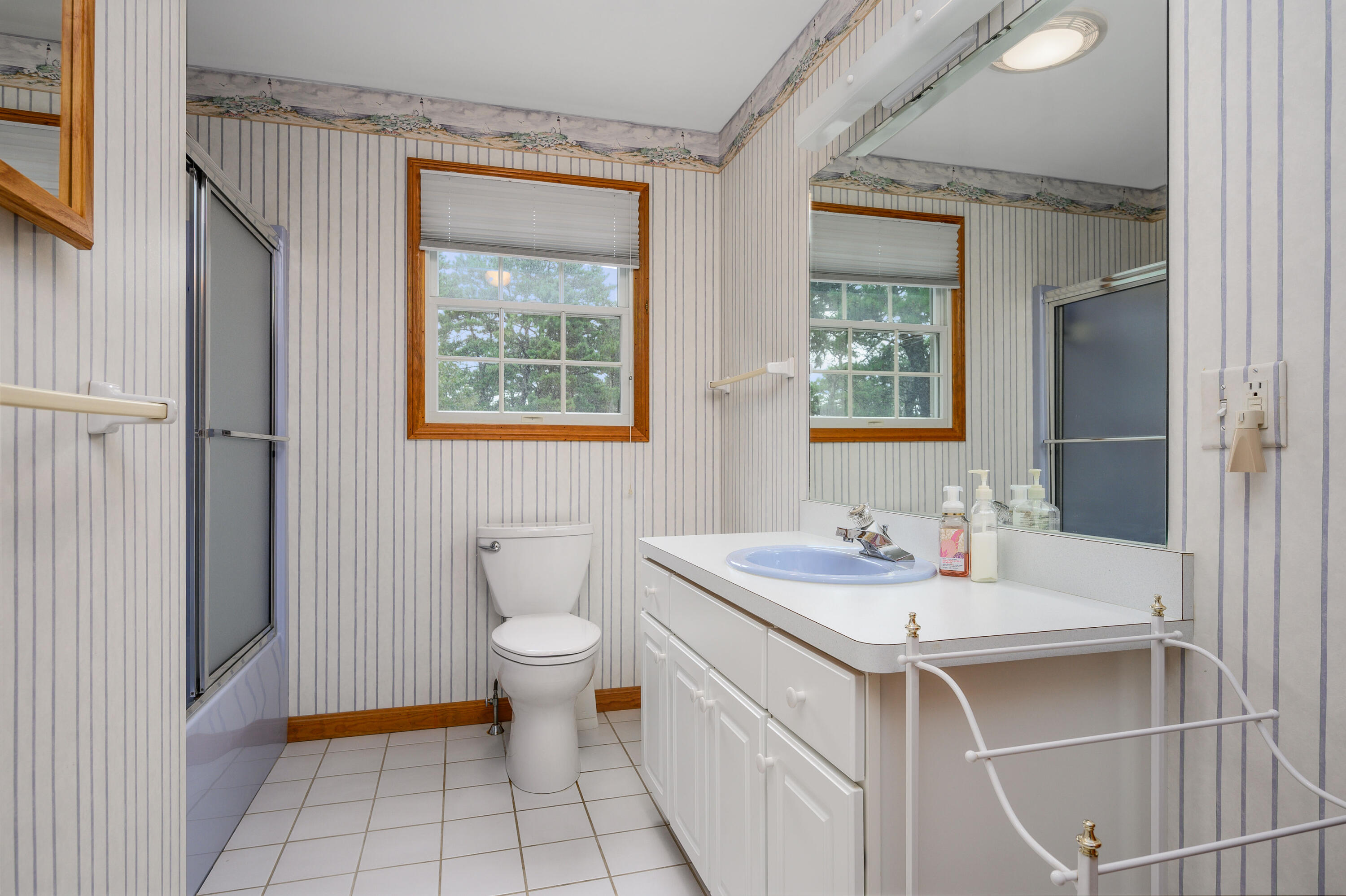 86 Old Wharf Road Wellfleet, MA 02667 - Photo 22 of 37 a bathroom with a sink toilet and vanity