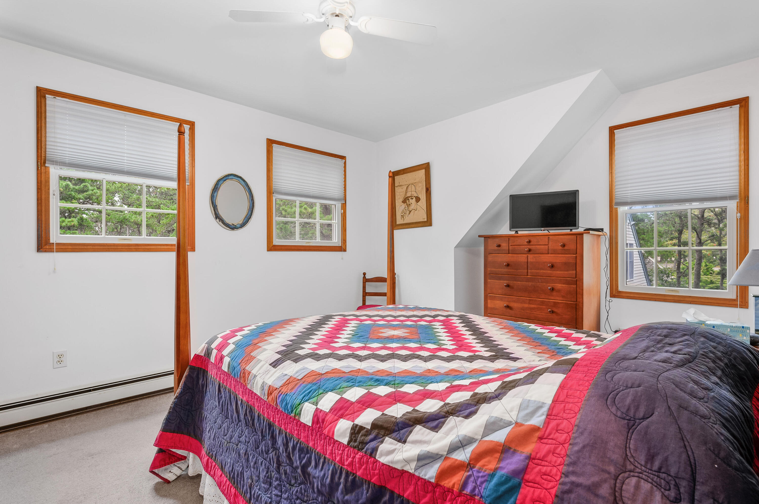 86 Old Wharf Road Wellfleet, MA 02667 - Photo 28 of 37 a bedroom with a bed a dresser and next to a window
