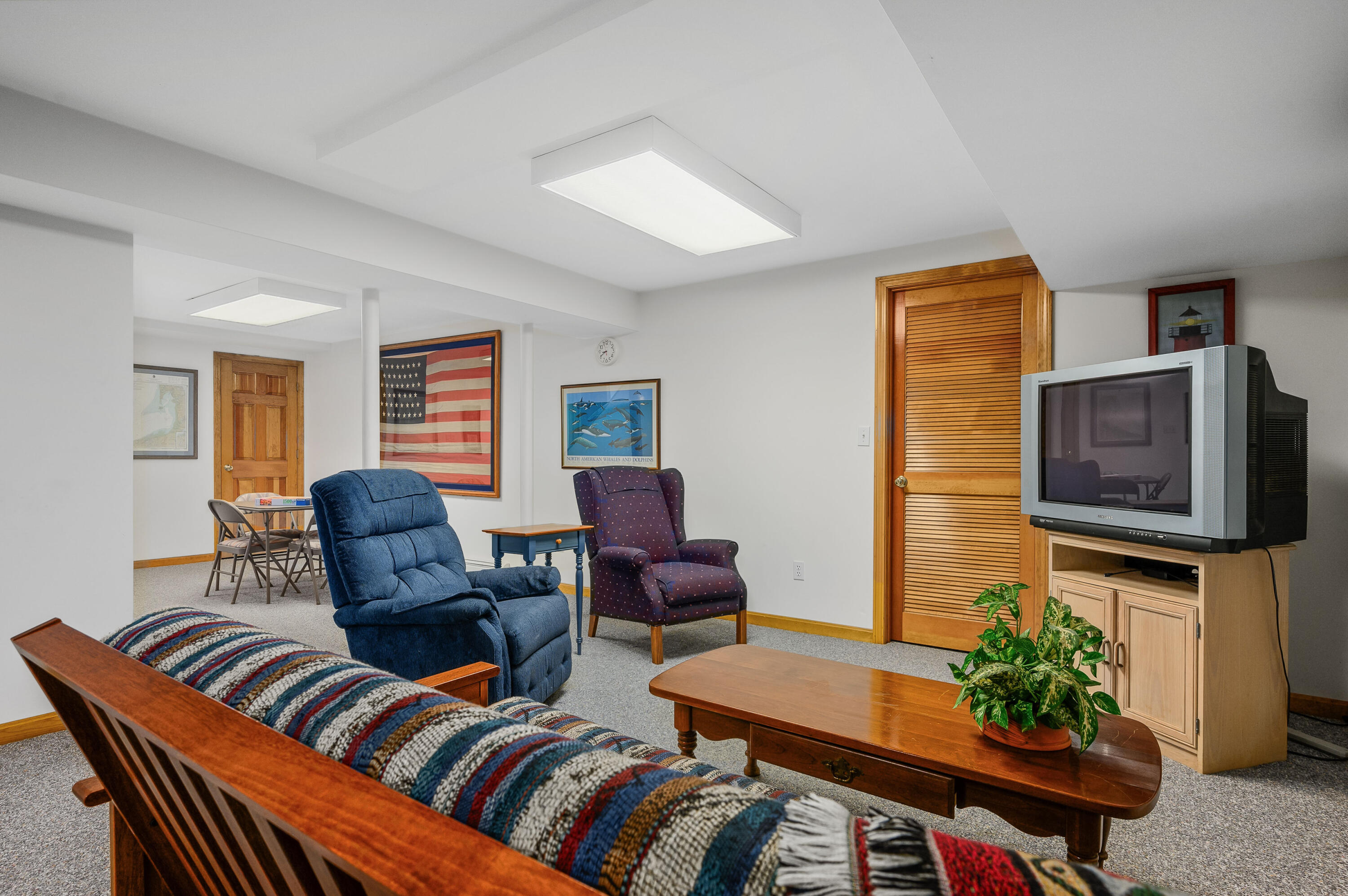 86 Old Wharf Road Wellfleet, MA 02667 - Photo 31 of 37 a living room with furniture and a flat screen tv