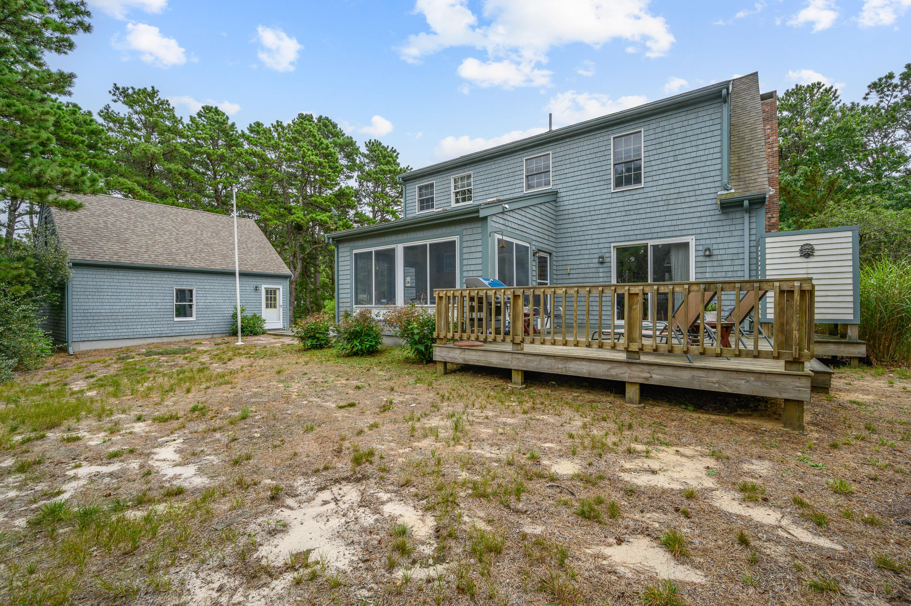 86 Old Wharf Road Wellfleet, MA 02667 - Photo 33 of 37 a view of a house with backyard and sitting area