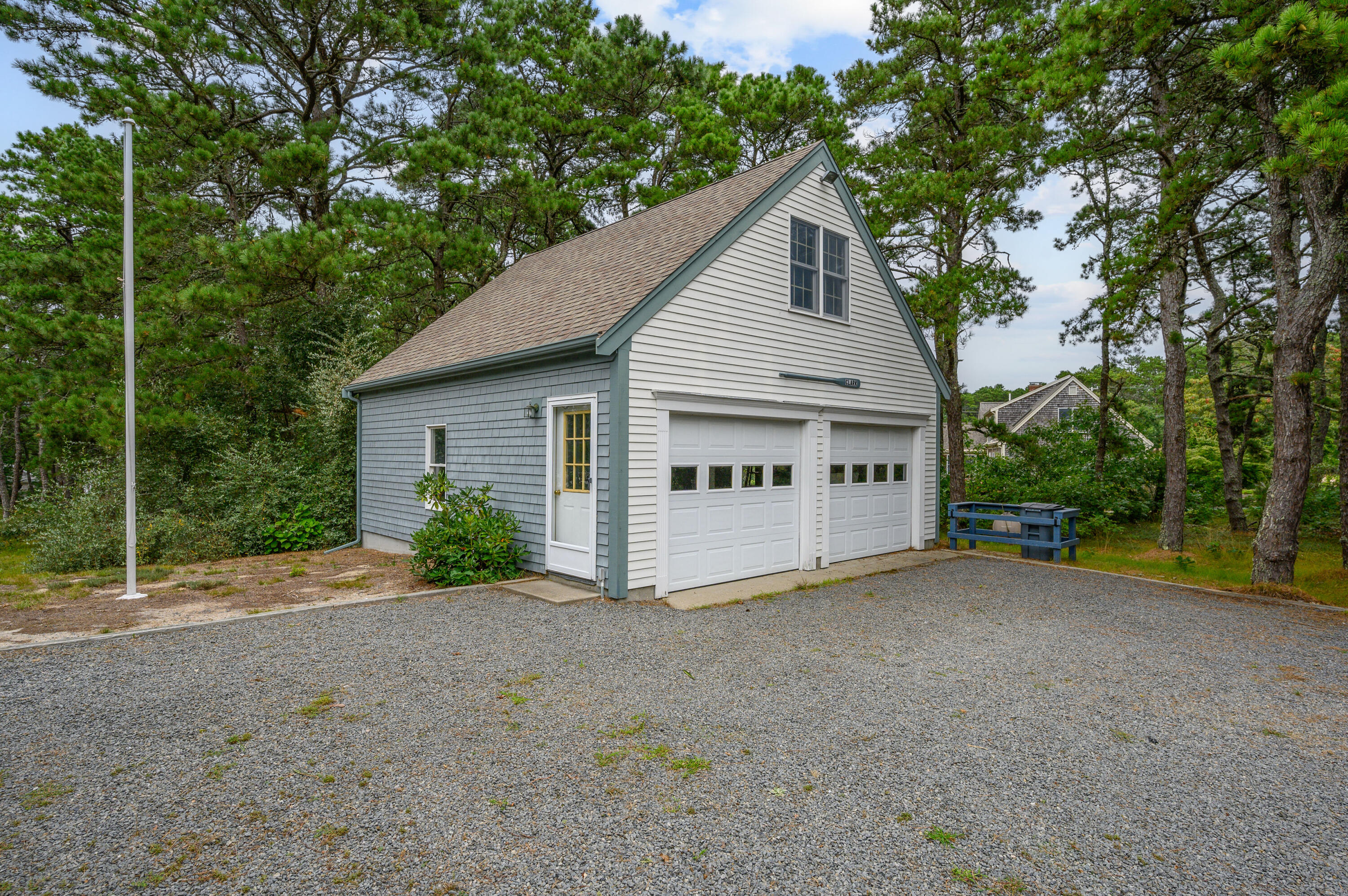 86 Old Wharf Road Wellfleet, MA 02667 - Photo 34 of 37 a view of a house with a yard and large trees