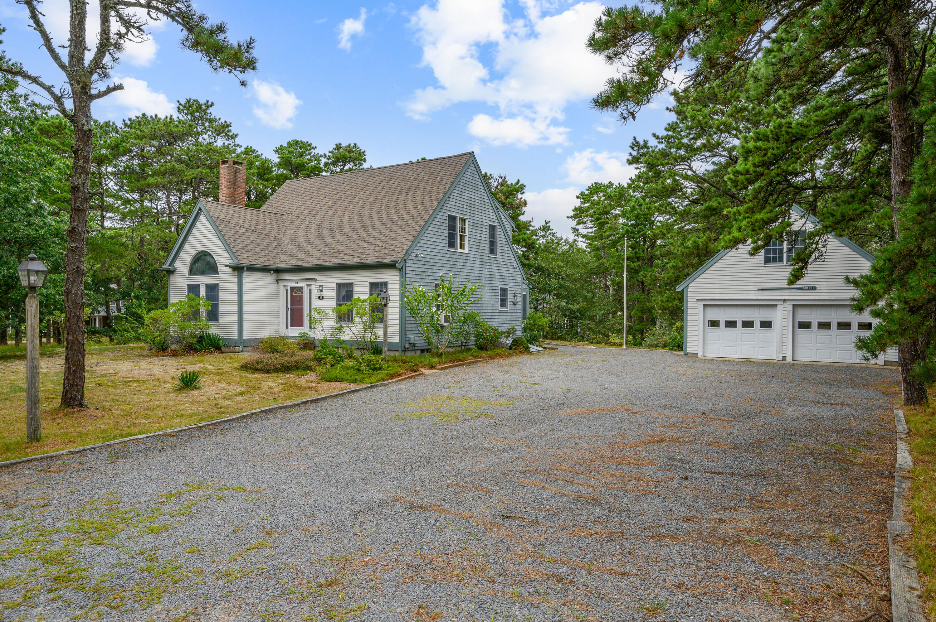 86 Old Wharf Road Wellfleet, MA 02667 - Photo 36 of 37 a view of a house with a yard and large tree