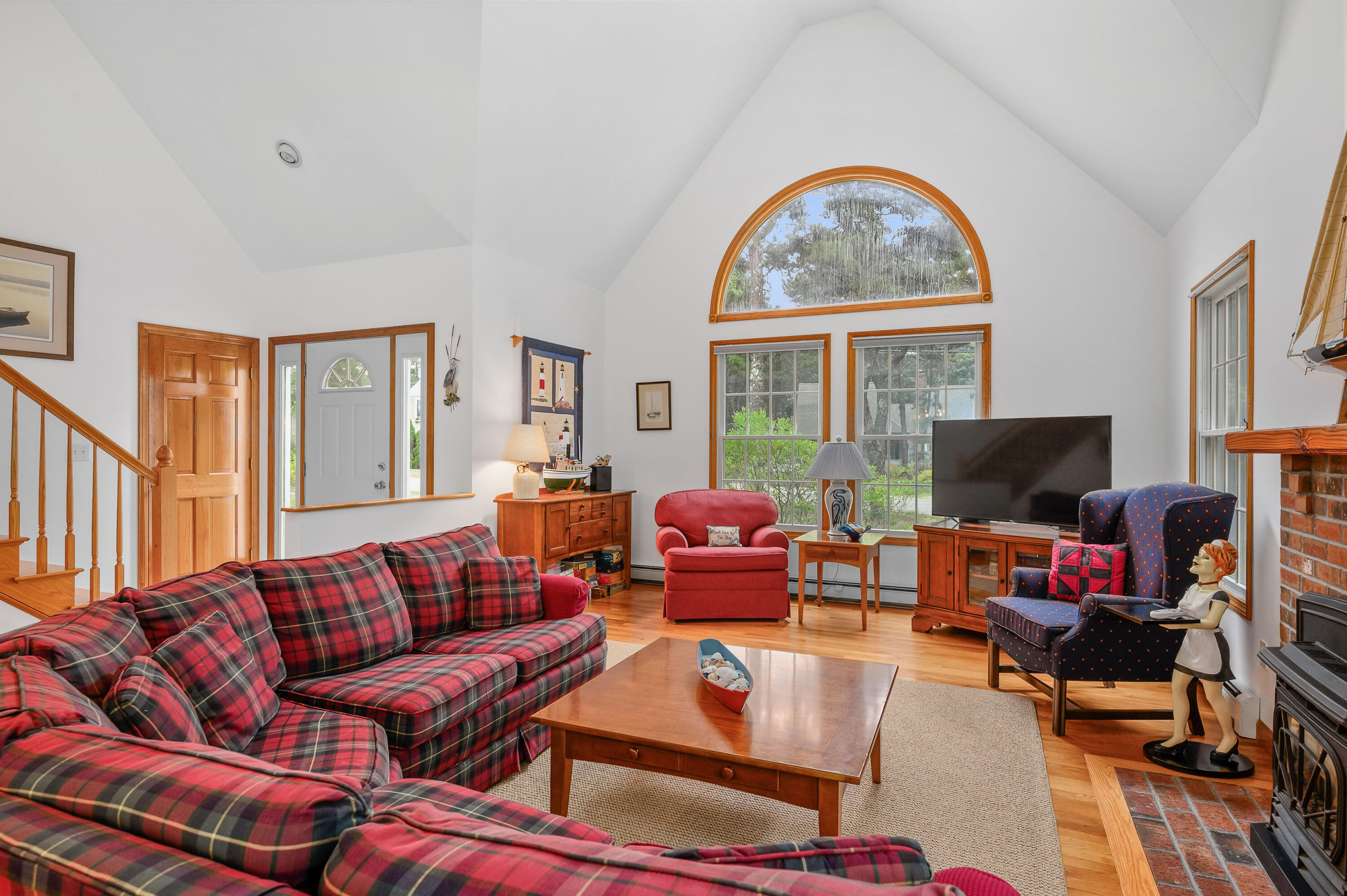 86 Old Wharf Road Wellfleet, MA 02667 - Photo 6 of 37 a living room with furniture a fireplace and a flat screen tv