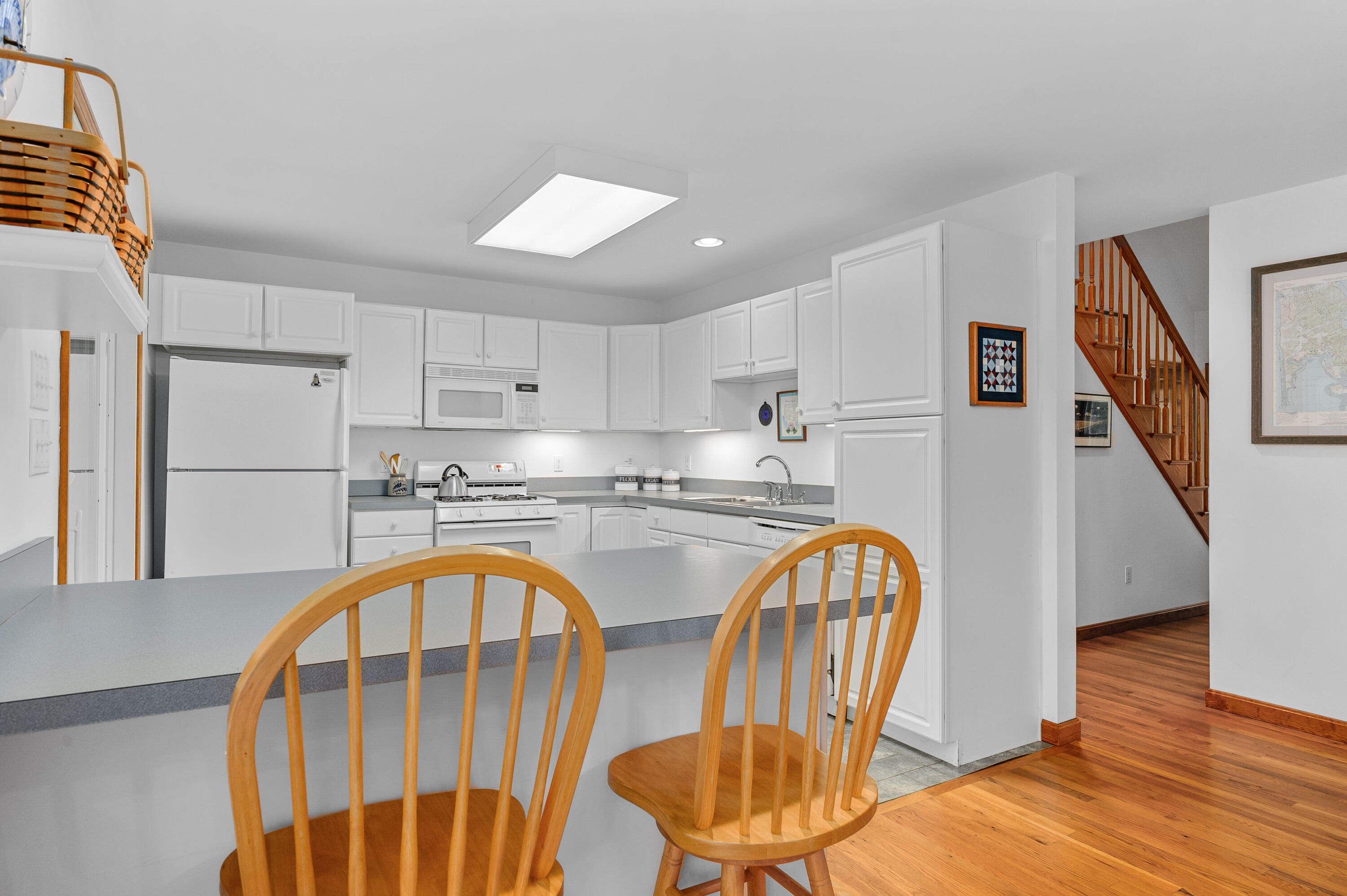 86 Old Wharf Road Wellfleet, MA 02667 - Photo 10 of 37 a view of living room kitchen with furniture and wooden floor