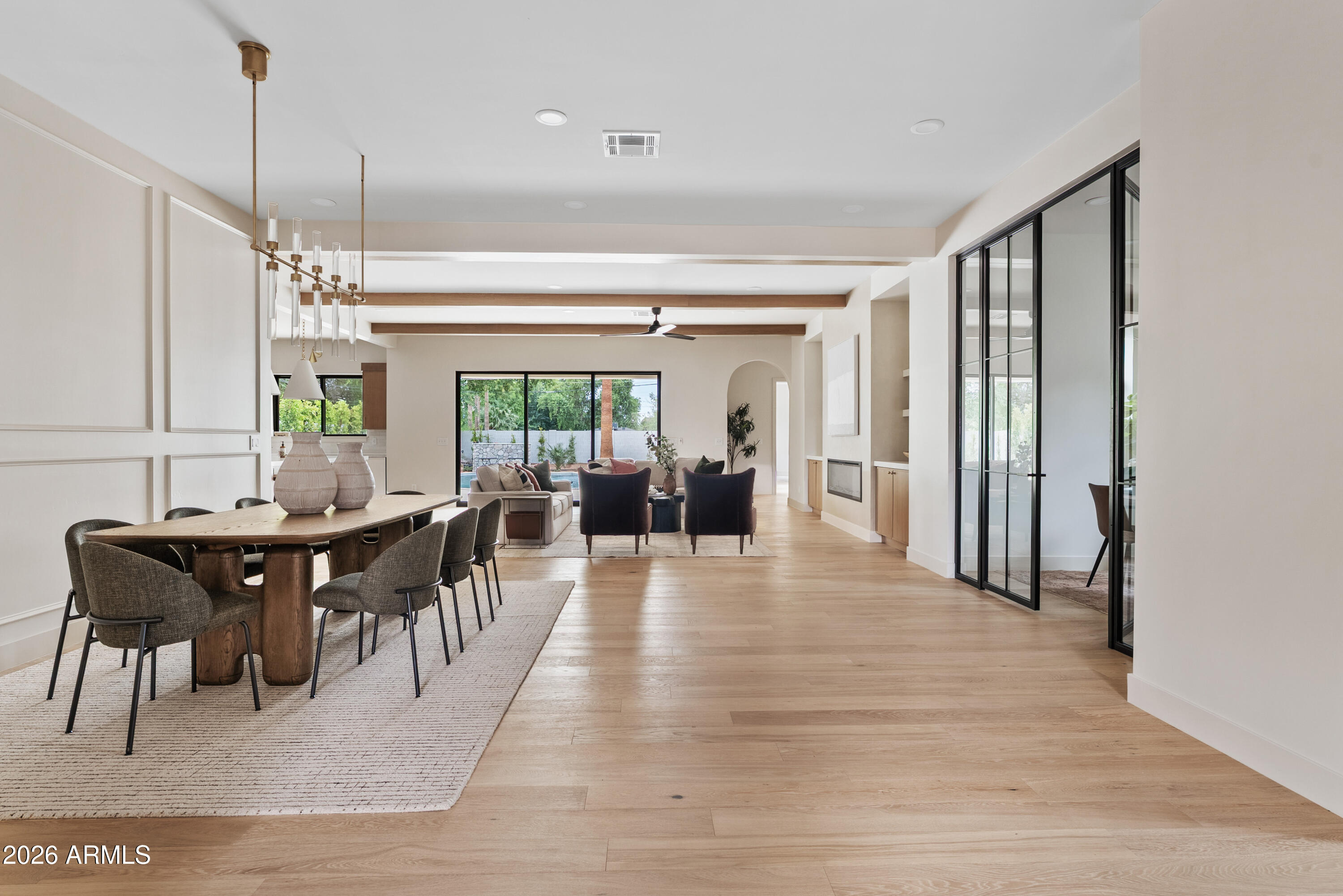 4035 East Osborn Road Phoenix, AZ 85018 - Photo 11 of 63 a view of a dining room with furniture window and wooden floor