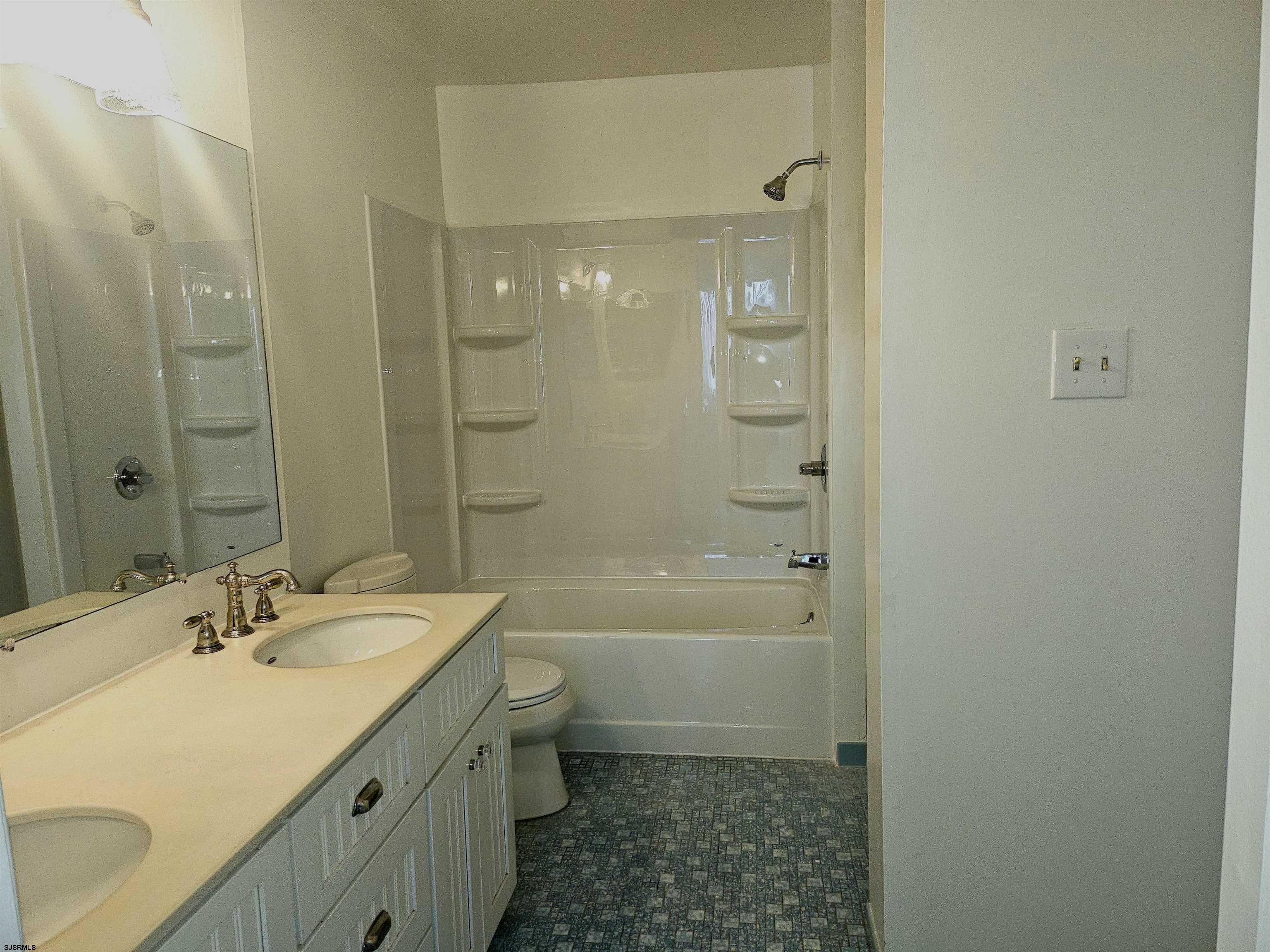 2127 Rhododendron Court, Unit 25 Mays Landing, NJ 08330 - Photo 13 of 15 a bathroom with a sink a toilet and shower