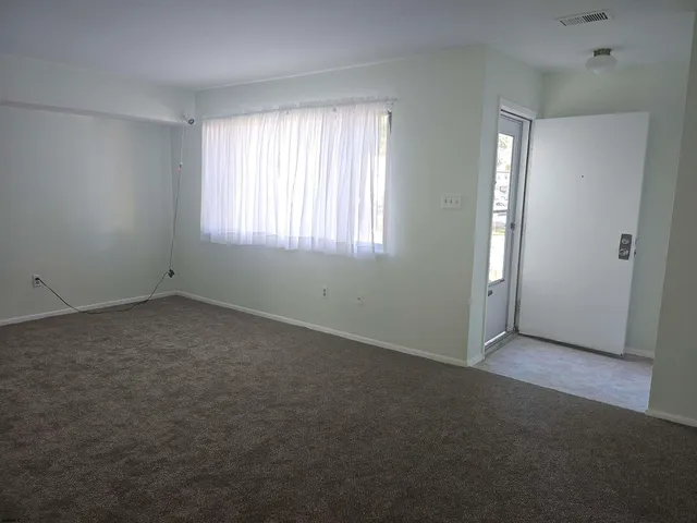 an empty room with windows