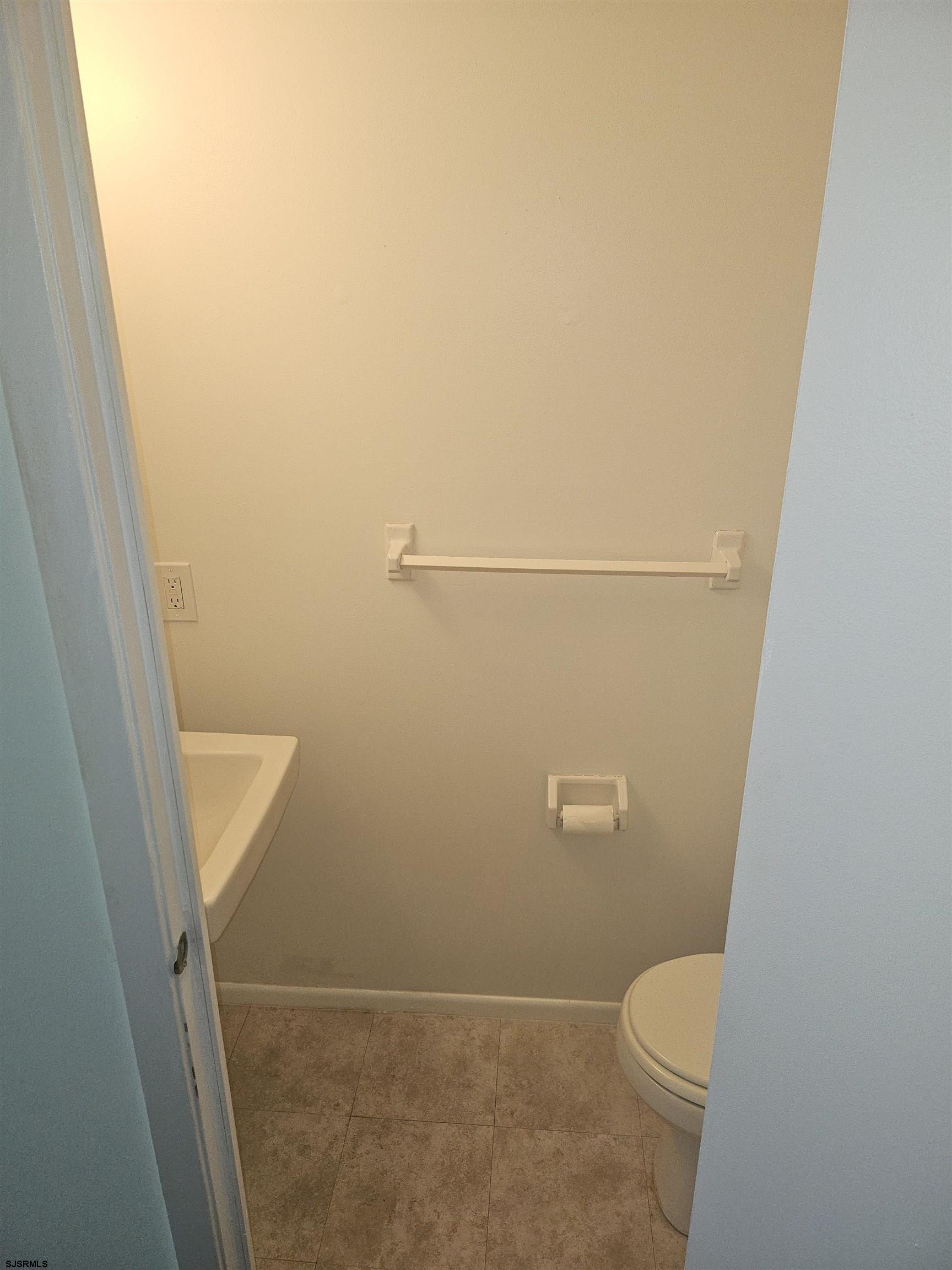 2127 Rhododendron Court, Unit 25 Mays Landing, NJ 08330 - Photo 5 of 15 a bathroom with a white toilet and sink