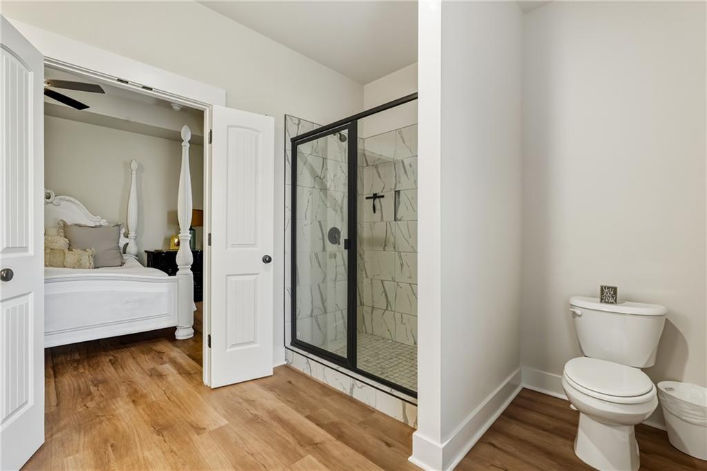 3462 Vinson Mountain Road Rockmart, GA 30153 - Photo 18 of 31 a bathroom with a toilet and a shower